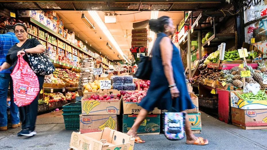 A woman is seen walking in a NYC bodega.