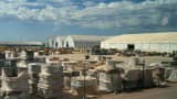 Electrical cables roll outside a series of assembly tents during a media tour of the Stargate AI data center in Abilene, Texas, USA, Tuesday, September 23, 2025. Stargate is a collaboration of OpenAI, Oracle and SoftBank, with promotional support from President Donald Trump, to build data centers and other infrastructure for artificial intelligence across the US.