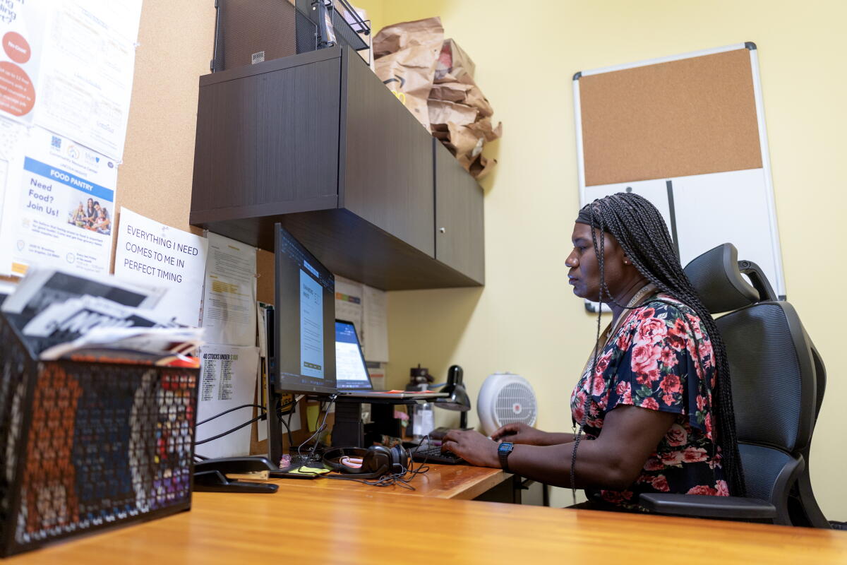 Nicole Bastiany, employment specialist, works in her office