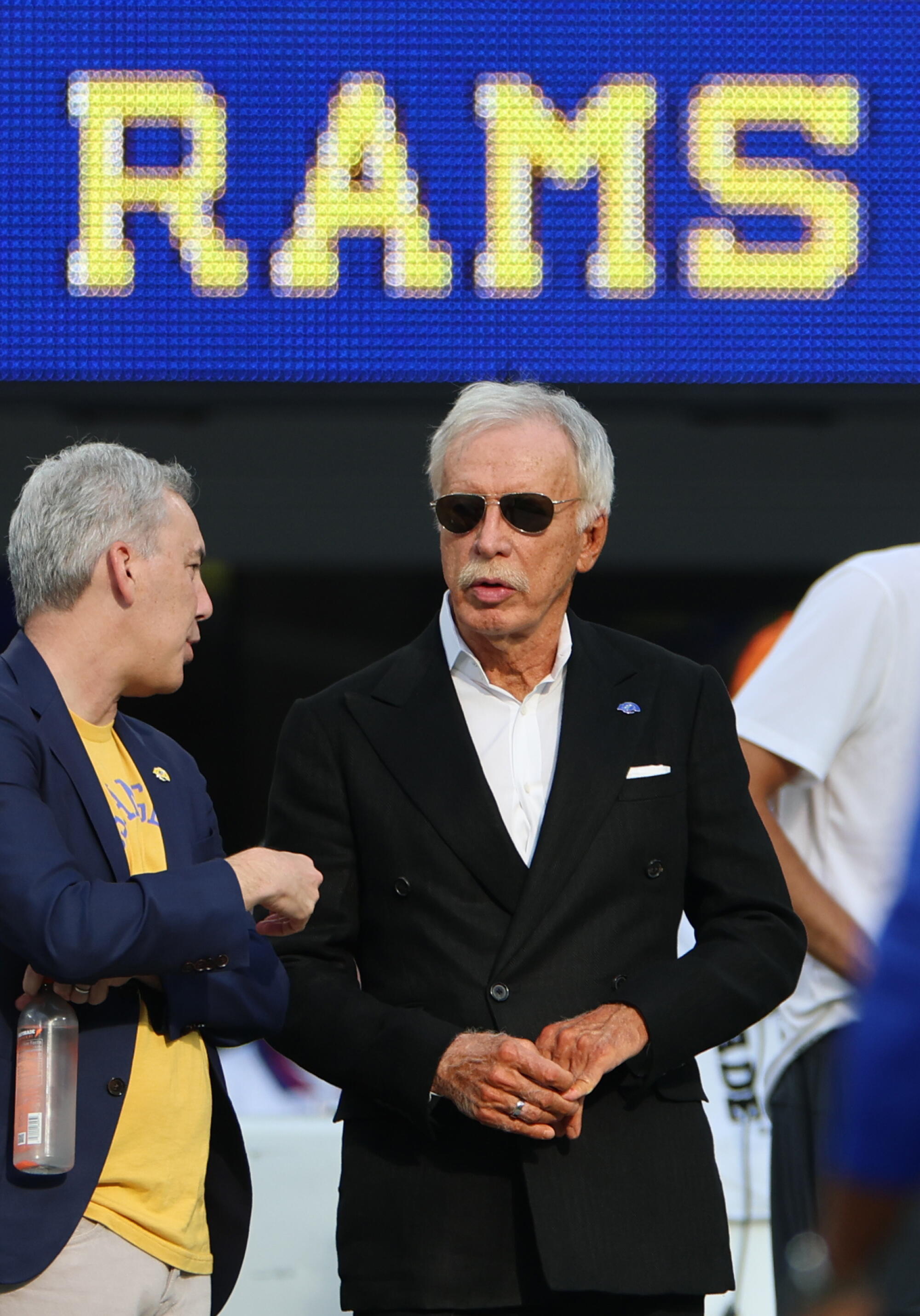 Rams owner Stan Kroenke (right) talks with Rams president Kevin Demoff before the Rams' game against the New York Giants.