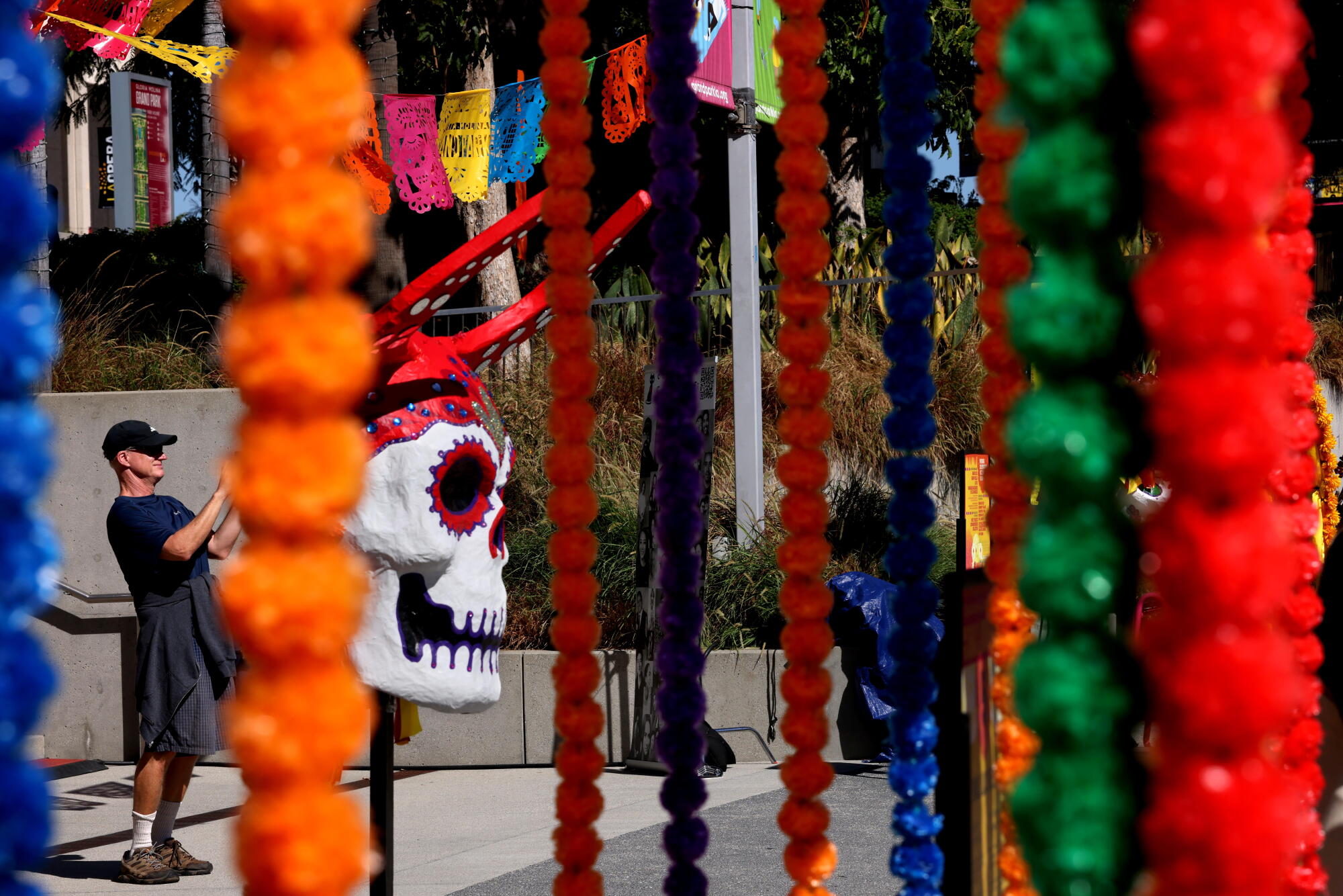 David Dunlop of Carpenteria poses for a photo in front of the Memorial Wall Altar.