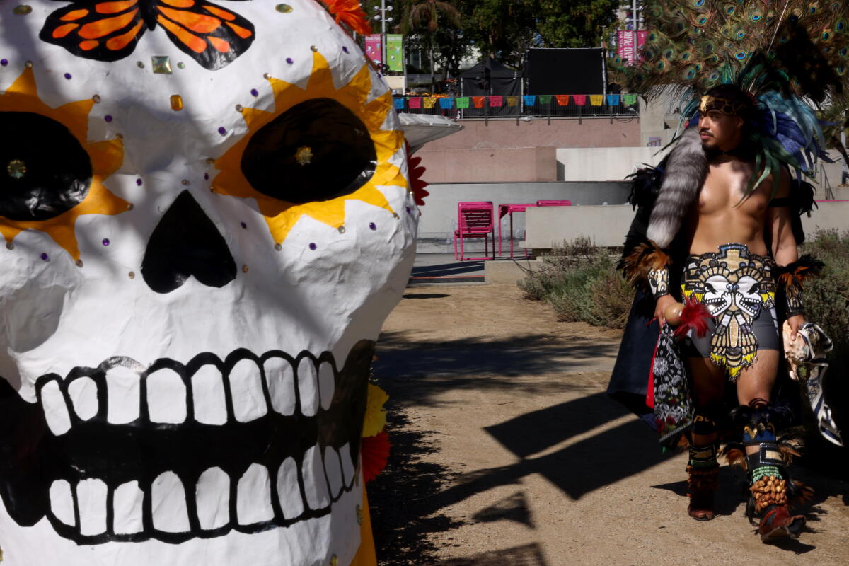 Jair Hernandez dressed in his best Aztec attire for the official opening of the Day of the Dead altar.