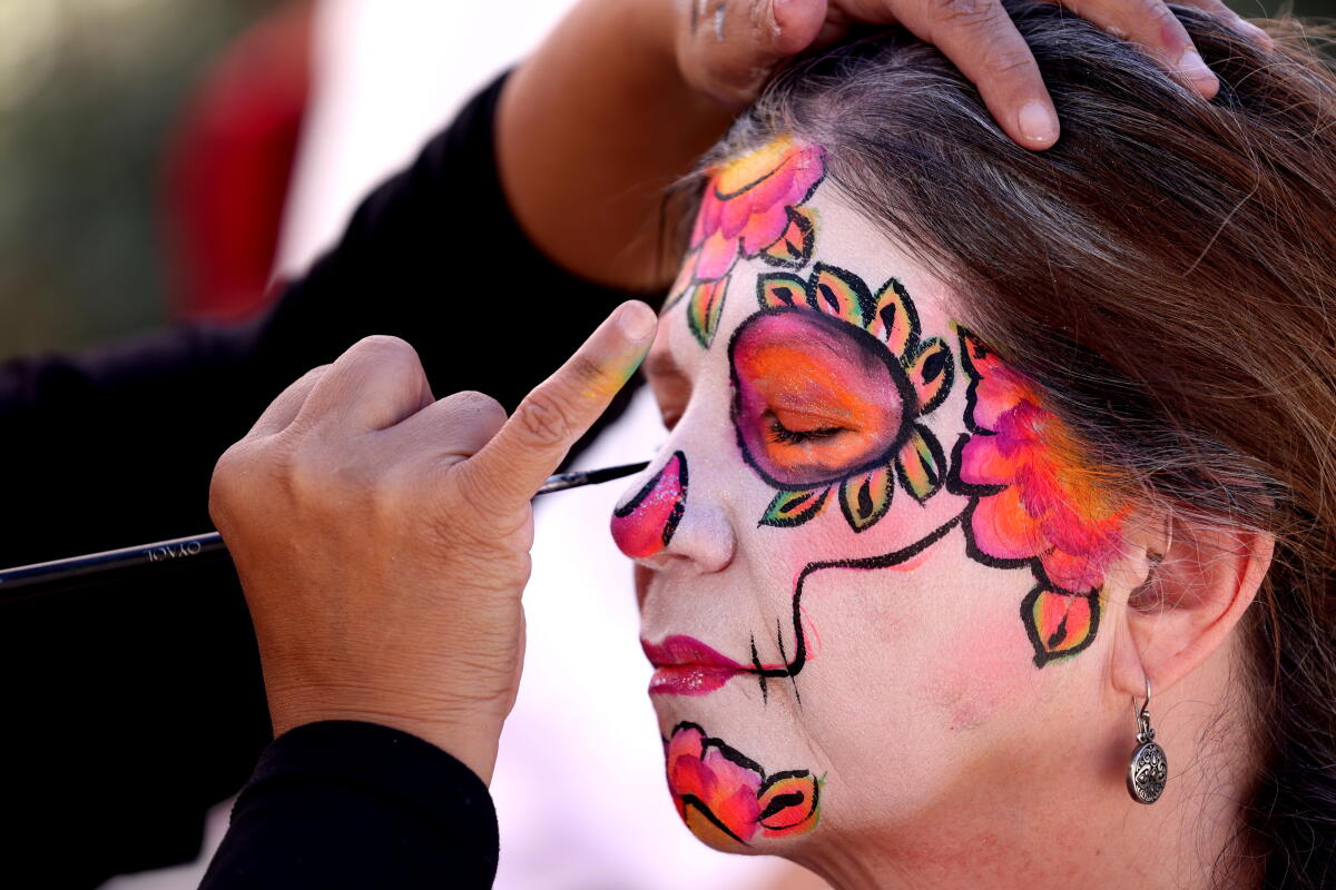 Lisa Markidis wears La Catrina makeup on her face.