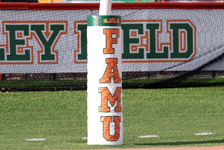 Panoramic view of goal posts with school logo inside Bragg Memorial Stadium at Ken Reilly Field