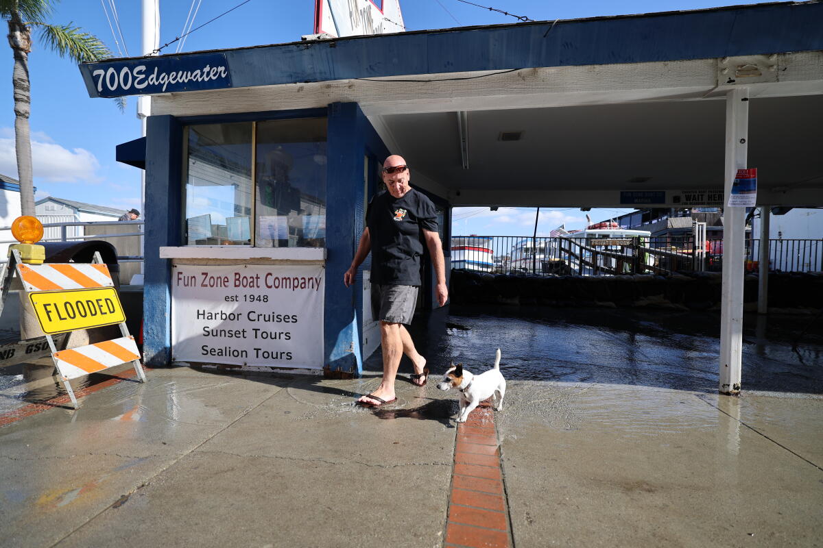 Fun Zone Boat Co. President Henk Wiessner and his dog Butters.