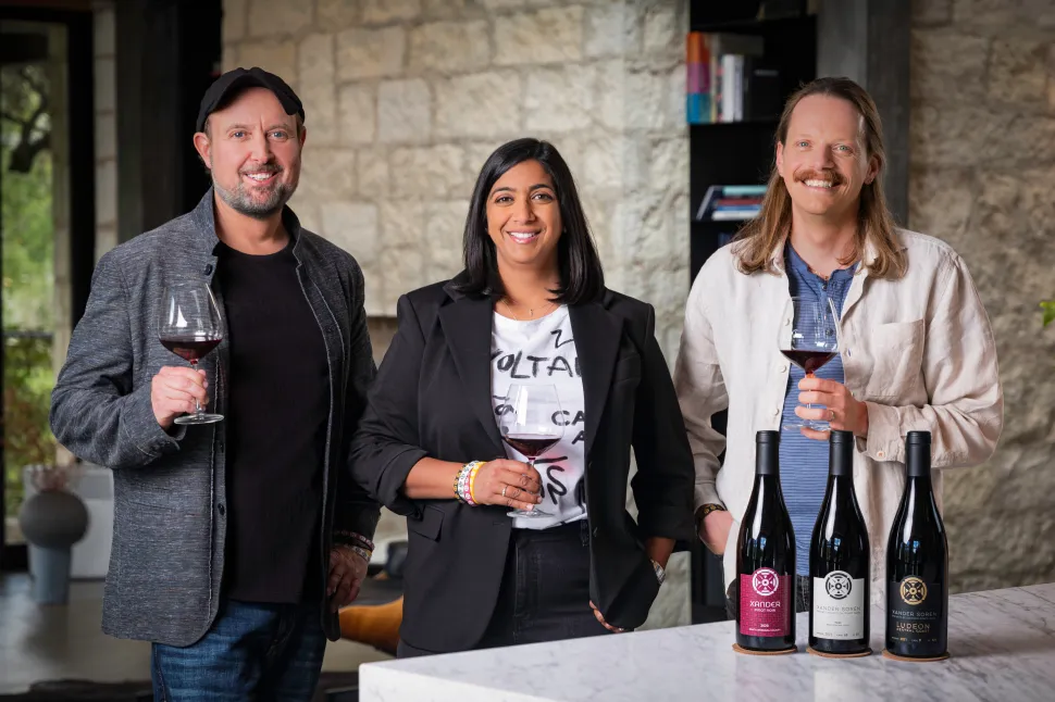 people holding wine glasses