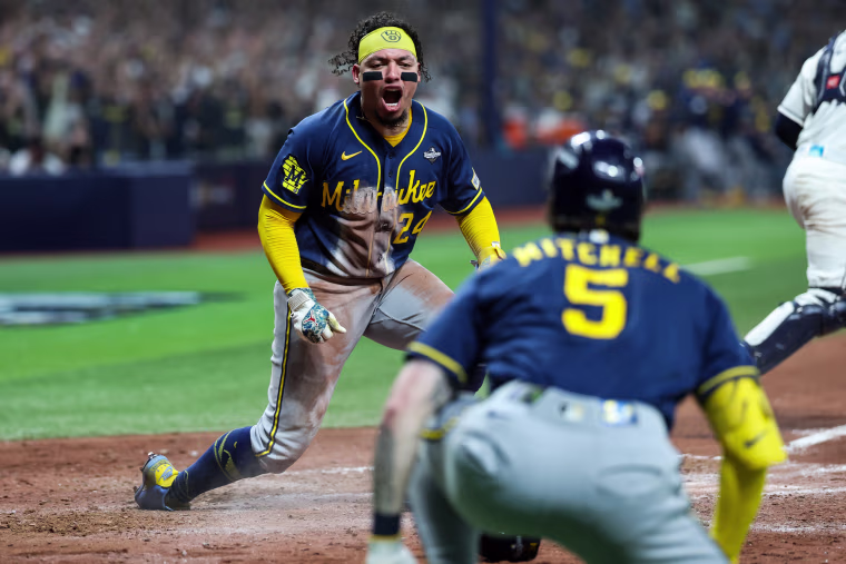 Milwaukee Brewers No. 24 William Contreras reacts after scoring.