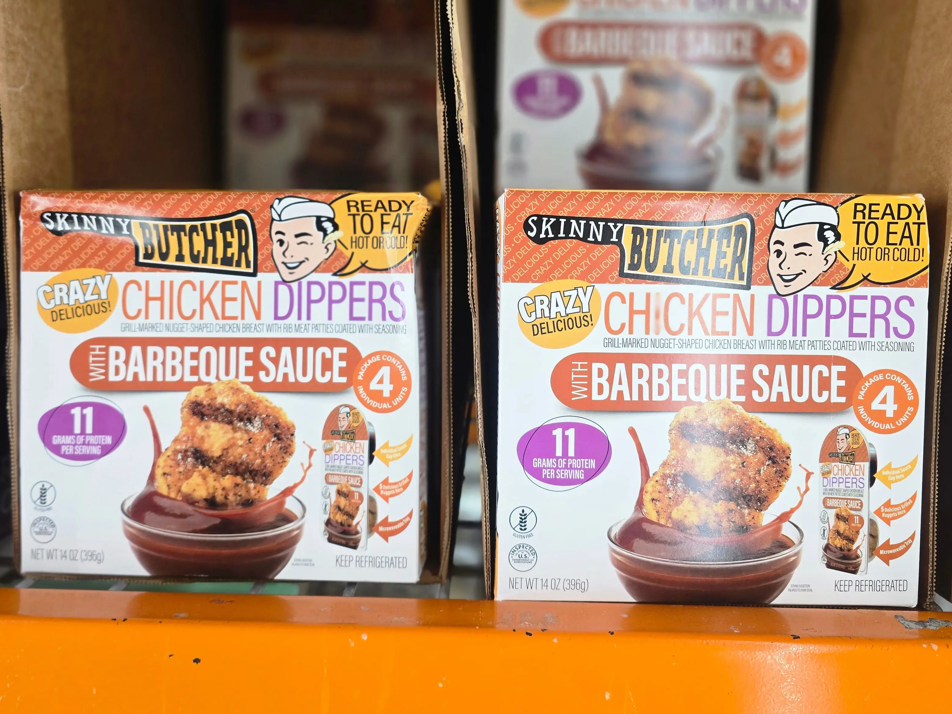 Box of skinny Butcher chicken dippers with barbecue sauce.