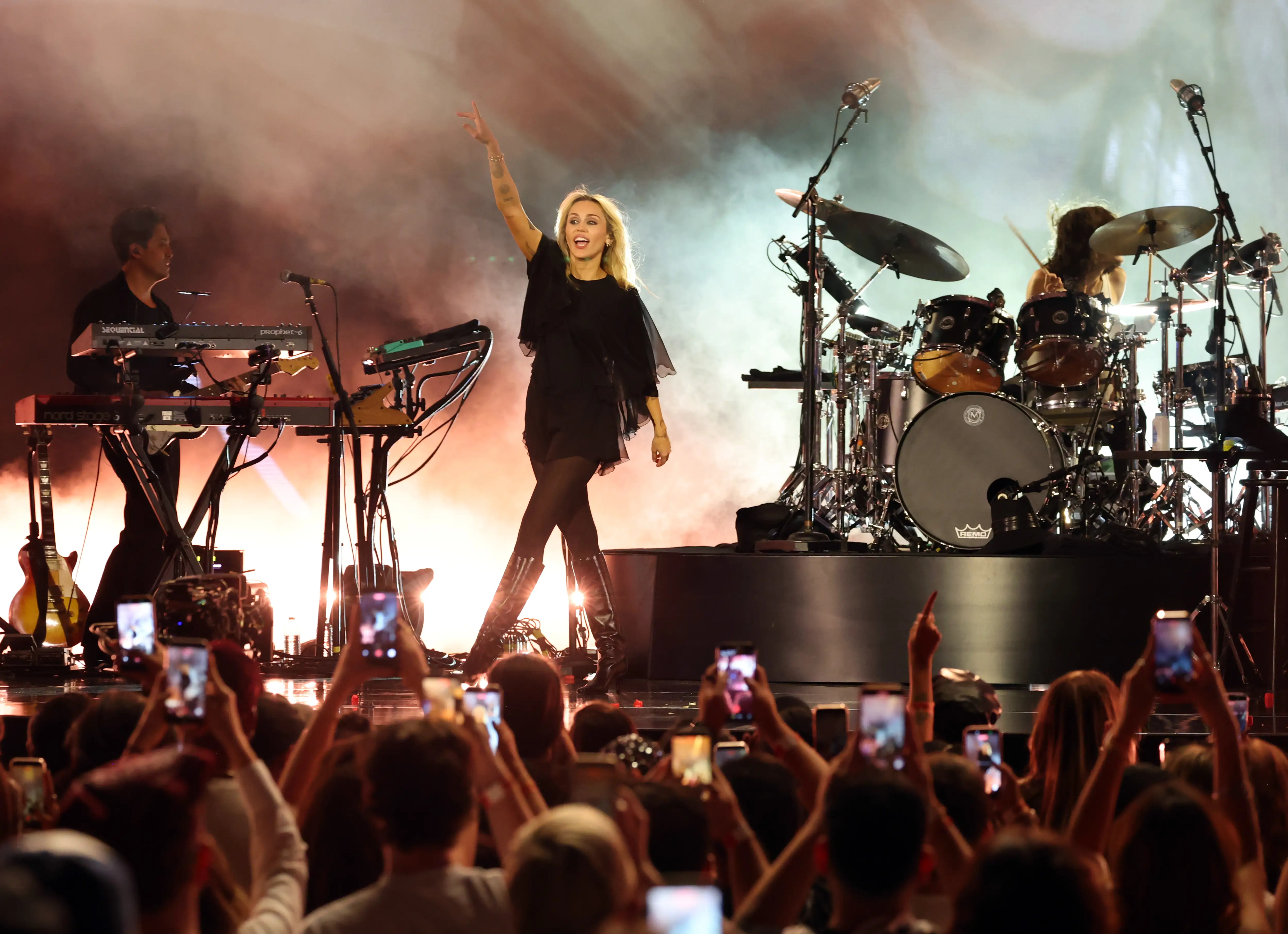 A woman performs at a concert.