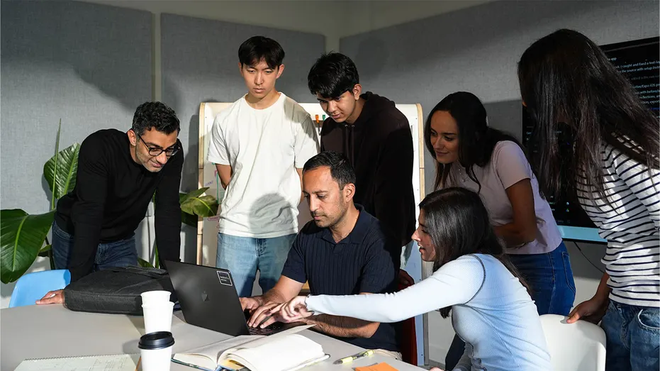Horowitz Andreessen Academy founder and CEO Gagan Biyani works with students in San Francisco