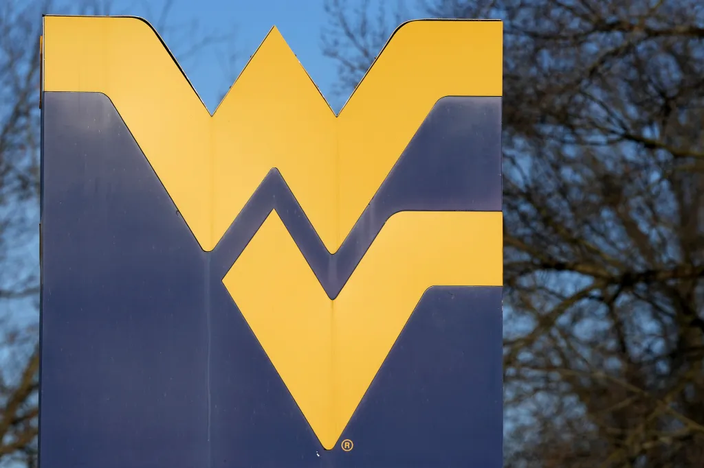 The West Virginia University logo is a yellow w and v on a blue background.