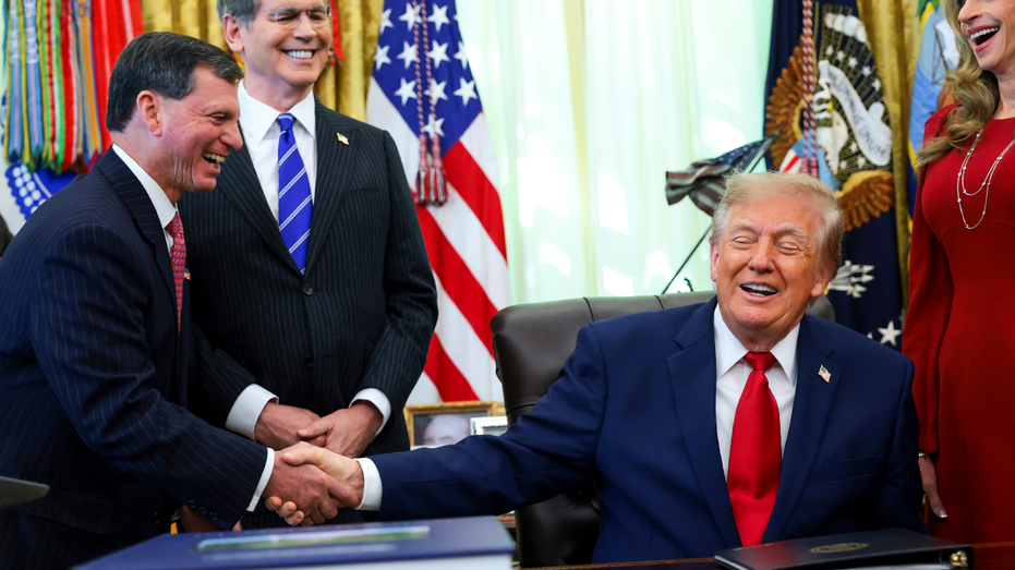 Social Security Administration Commissioner Frank Bisignano shakes hands with US President Donald Trump