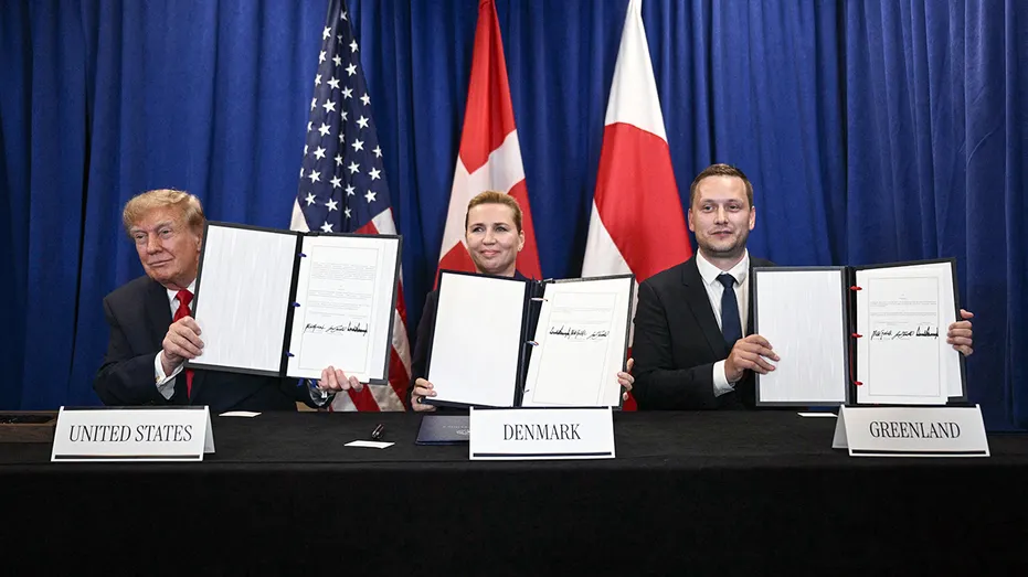 The leaders of the United States, Denmark and Greenland hold the signed agreement.