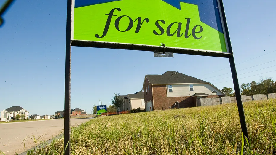 Missouri house in the background of a 'for sale' sign