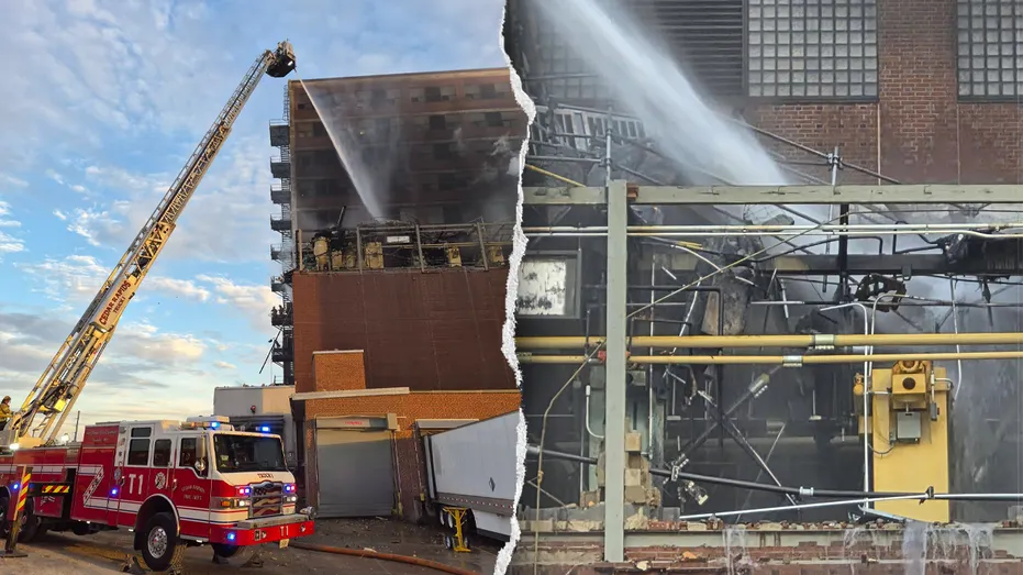 Firefighters work near the plant after the explosion and fire.