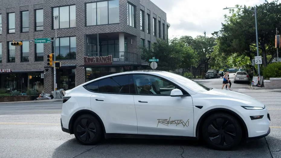 A Tesla robotaxi drives down the street on South Congress Avenue in Austin, Texas, on June 22, 2025.