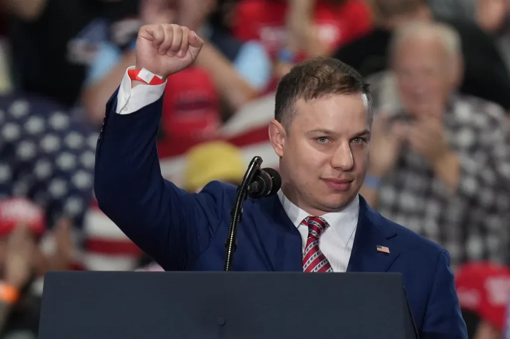 U.S. House of Representatives candidate Anthony Constantine raises his fist at a campaign rally.
