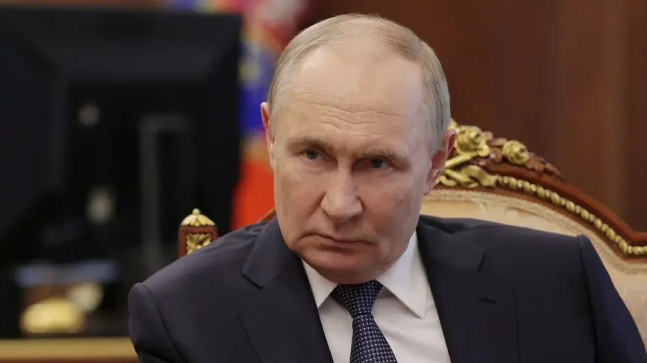 Russian President Vladimir Putin listens during a meeting in the Kremlin